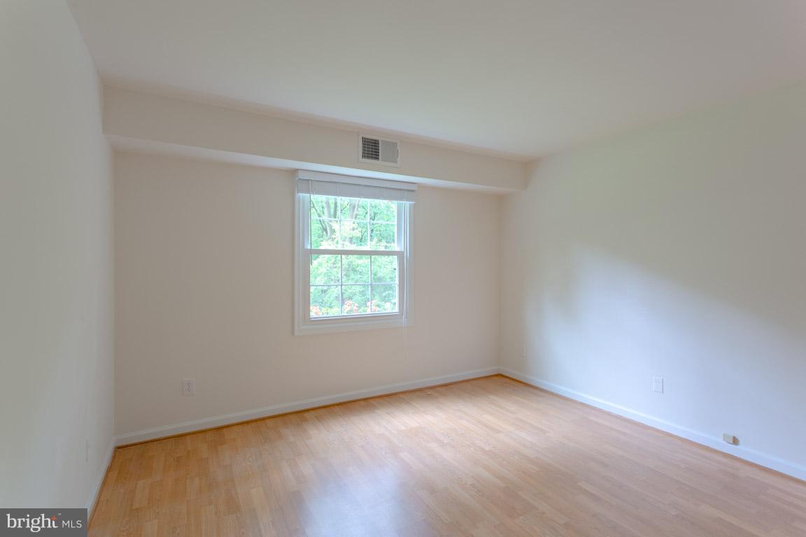 8110 Colony Point Road, Unit K Springfield, VA 22152 - Photo 16 of 30 an empty room with a window