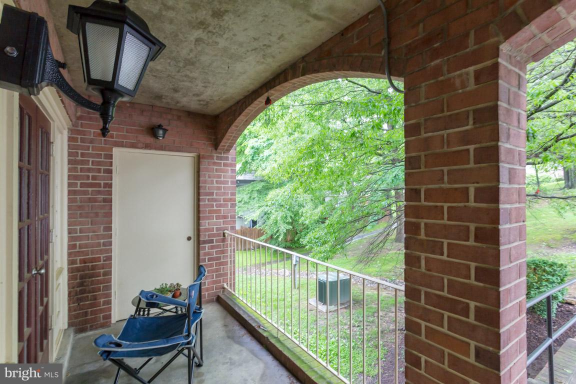 8110 Colony Point Road, Unit K Springfield, VA 22152 - Photo 3 of 30 a view of a chair and table in the balcony