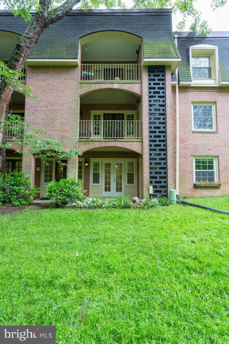 8110 Colony Point Road, Unit K Springfield, VA 22152 - Photo 21 of 30 a front view of a house with garden