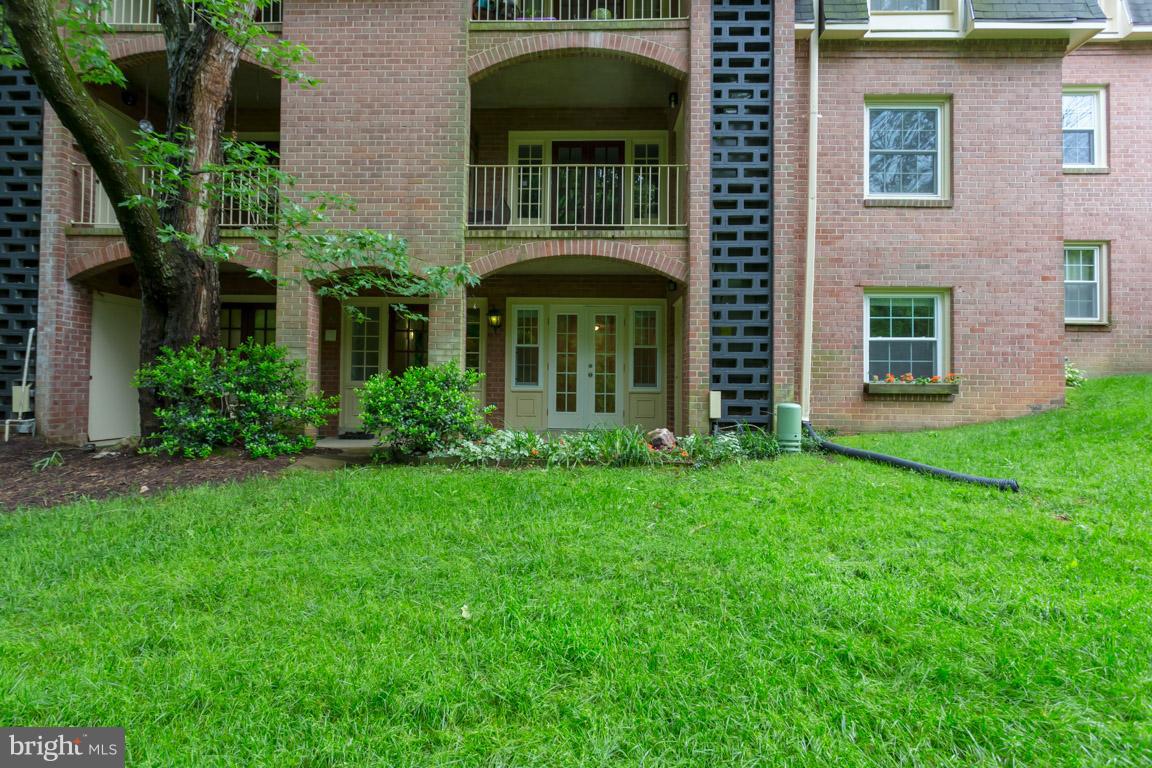 8110 Colony Point Road, Unit K Springfield, VA 22152 - Photo 22 of 30 a front view of a house with garden