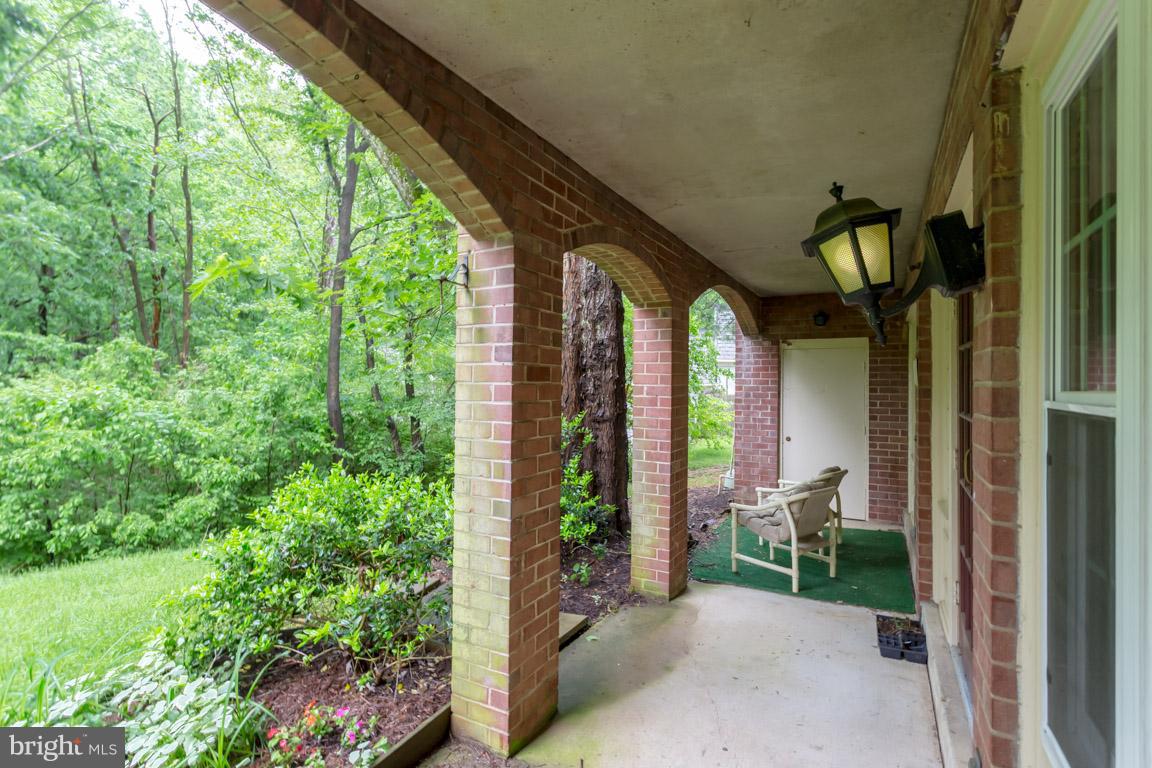 8110 Colony Point Road, Unit K Springfield, VA 22152 - Photo 24 of 30 a view of porch with chairs and potted plants
