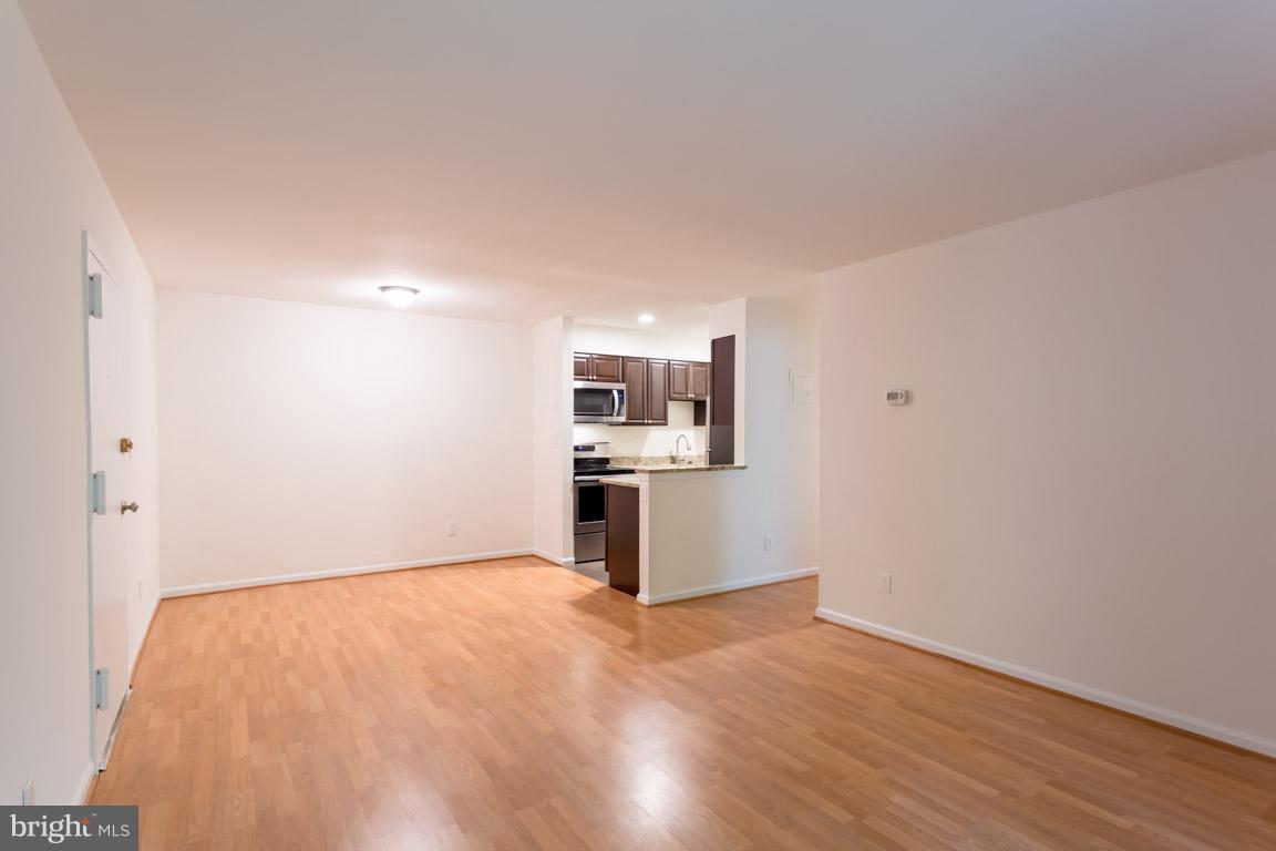 8110 Colony Point Road, Unit K Springfield, VA 22152 - Photo 8 of 30 a view of a kitchen with wooden floor and electronic appliances