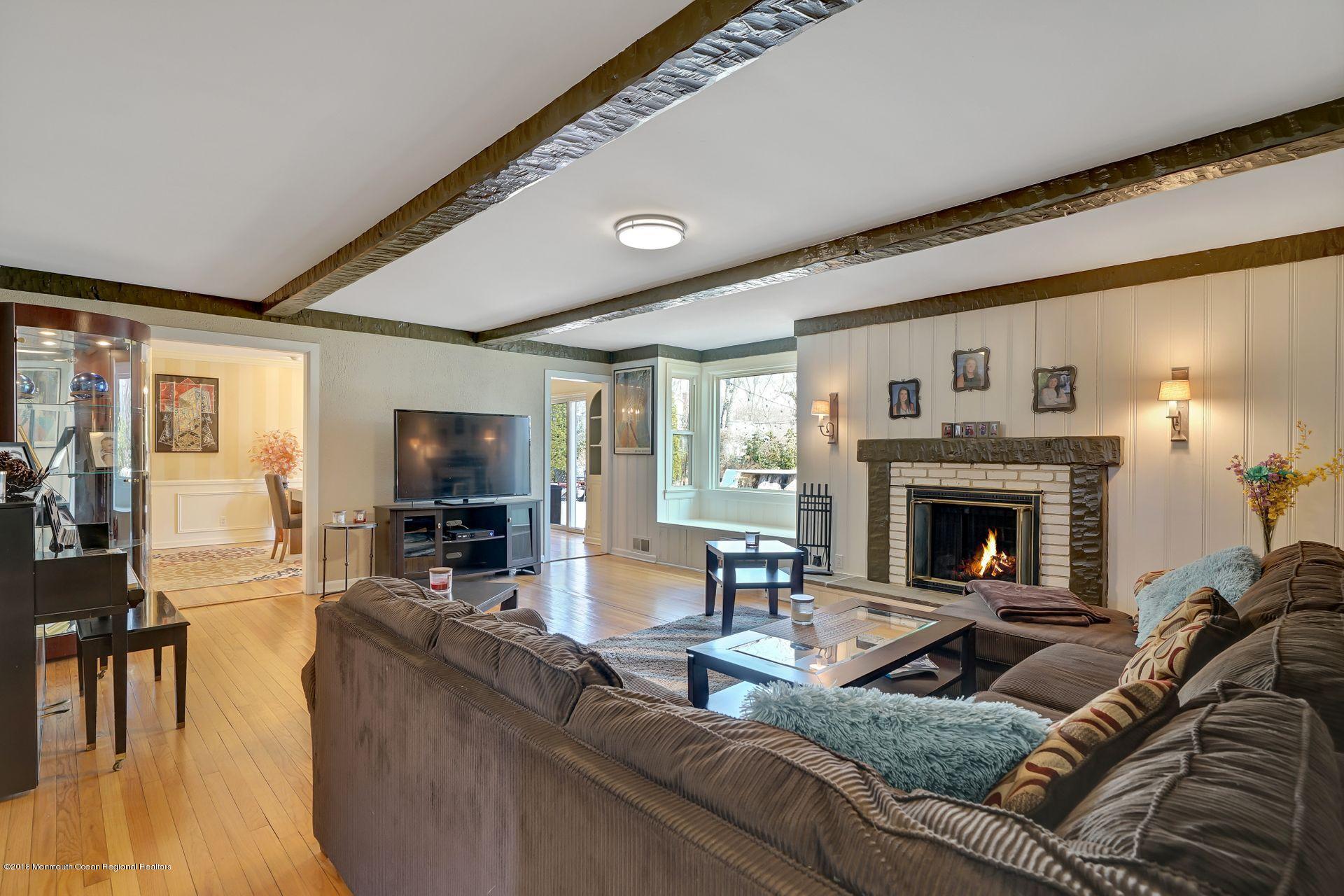 11 Heathcliff Road Rumson, NJ 07760 - Photo 9 of 31 a living room with furniture and a fireplace