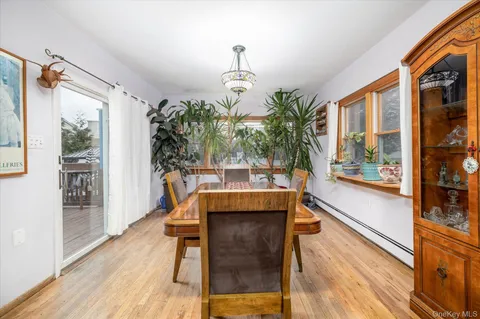 a dining room with large window