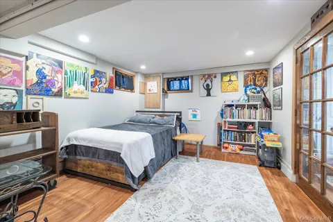 a bedroom with a bed and a book shelf