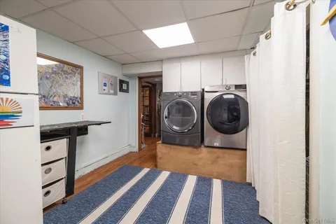 a view of a hallway with washer and dryer