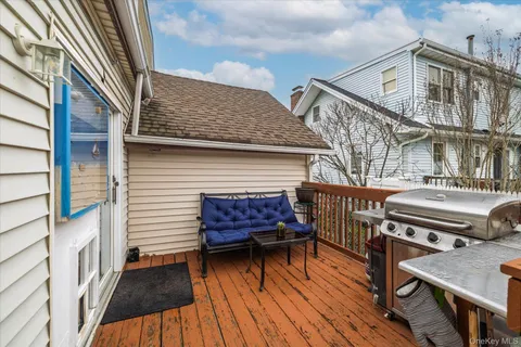 a view of a roof deck with patio