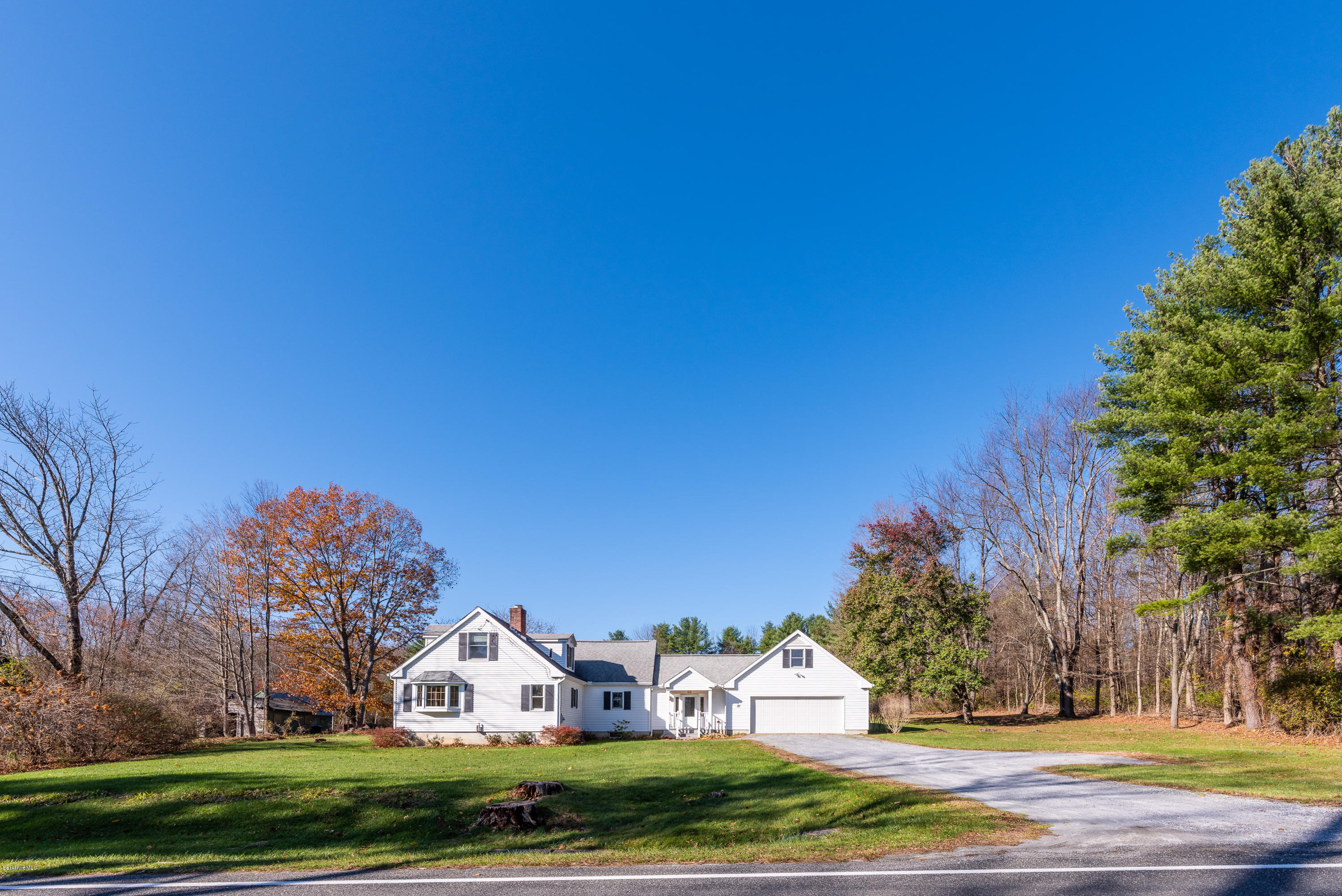 31 Interlaken Road Stockbridge, MA 01266 - Photo 1 of 34 a front view of house with yard
