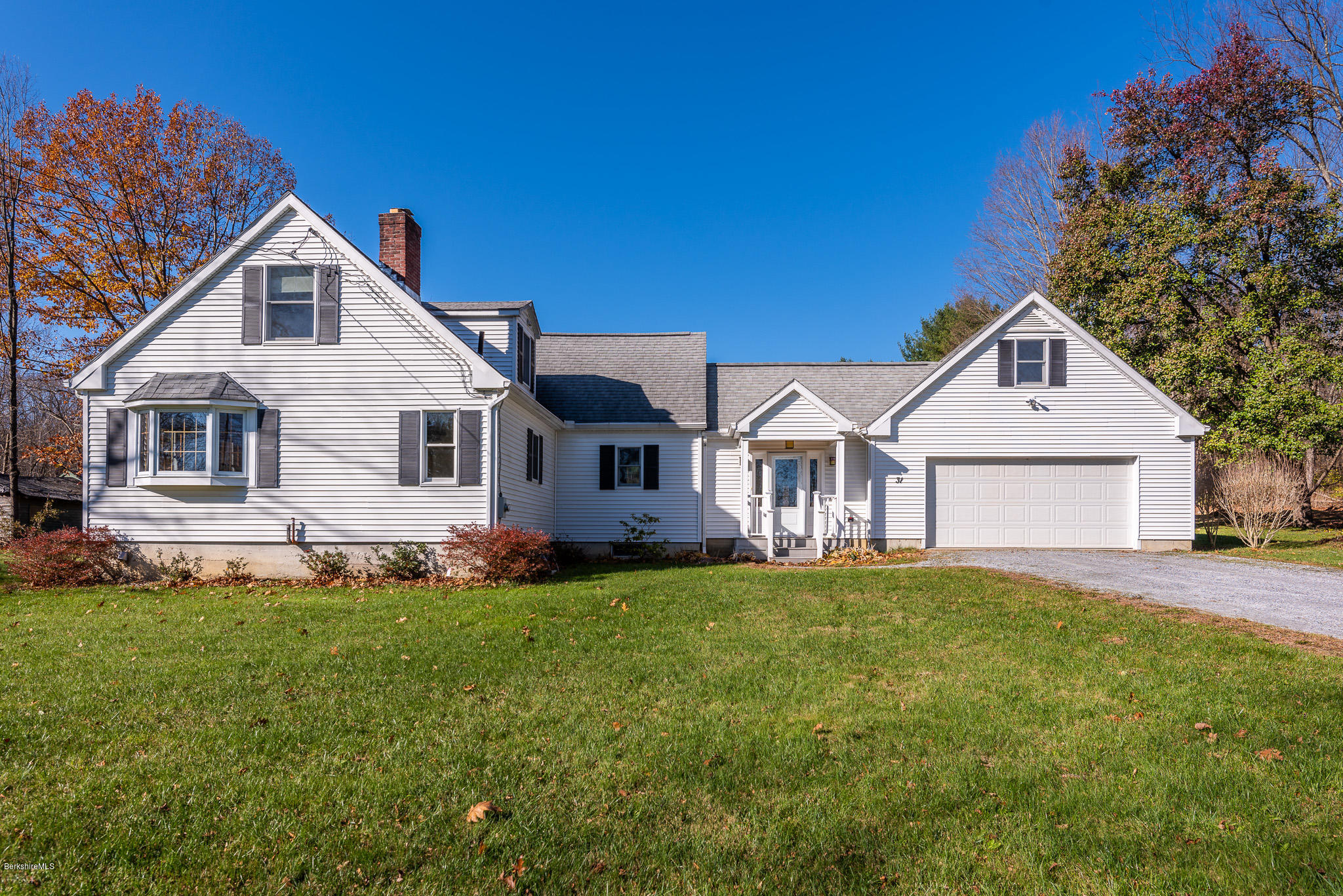 31 Interlaken Road Stockbridge, MA 01266 - Photo 2 of 34 a front view of a house with a yard