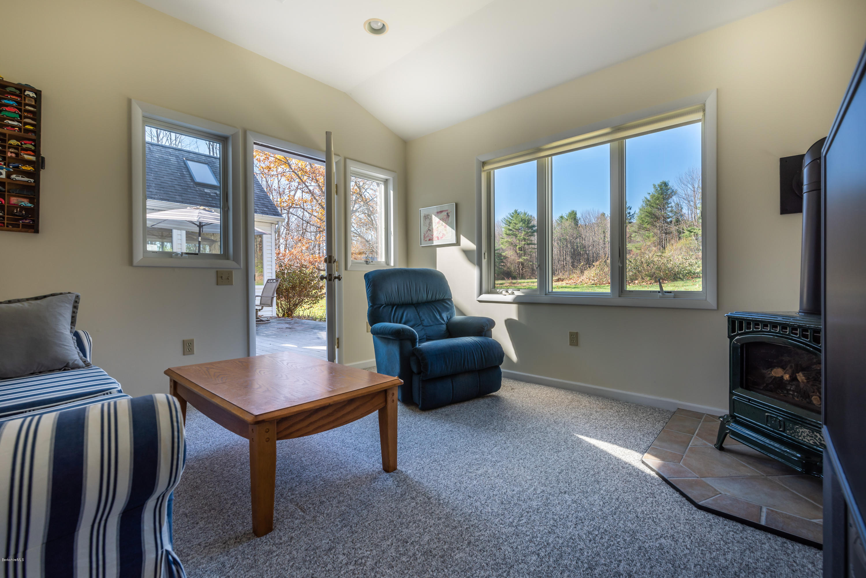 31 Interlaken Road Stockbridge, MA 01266 - Photo 16 of 34 a living room with furniture and a flat screen tv