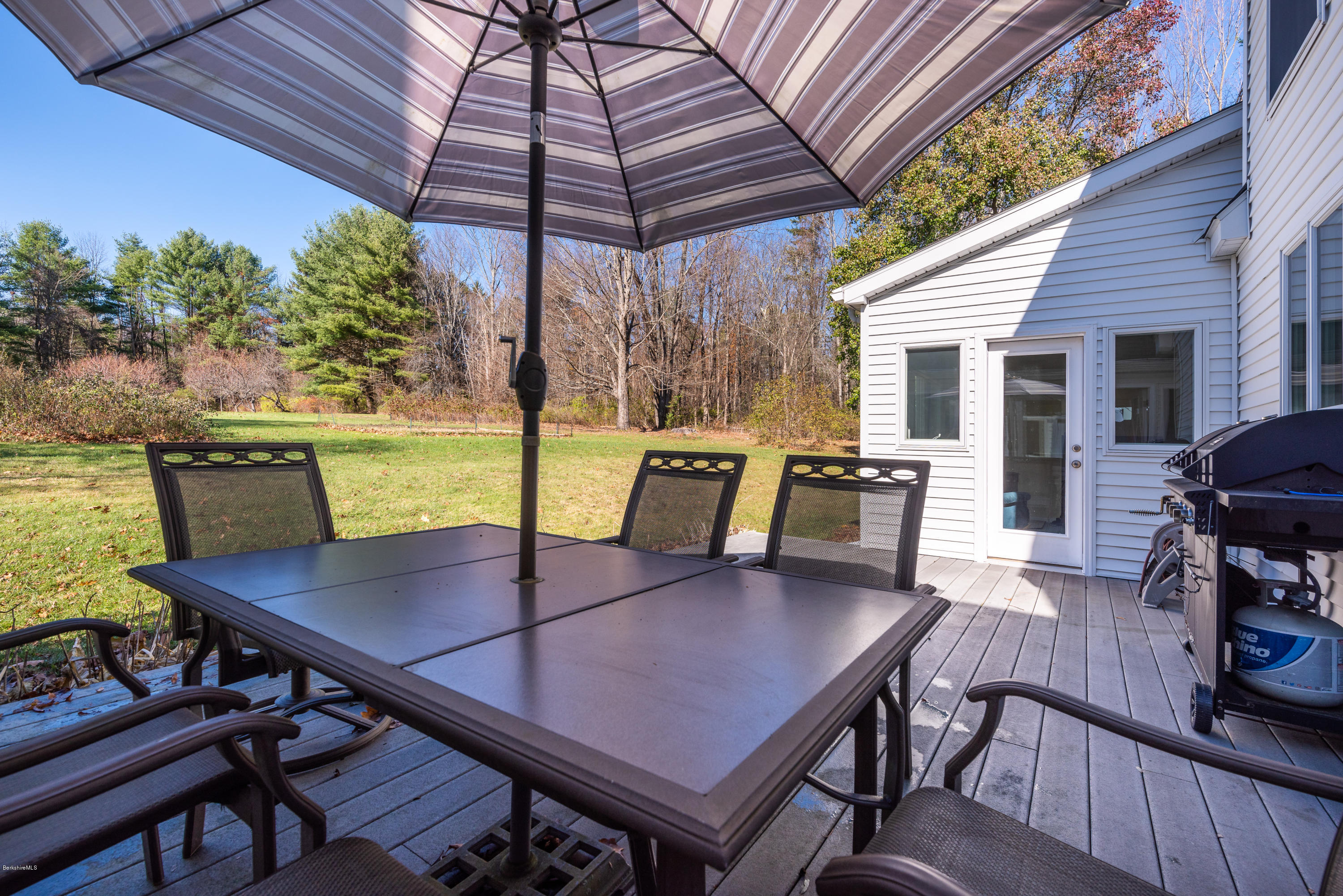 31 Interlaken Road Stockbridge, MA 01266 - Photo 20 of 34 a view of a patio with table and chairs and potted plants