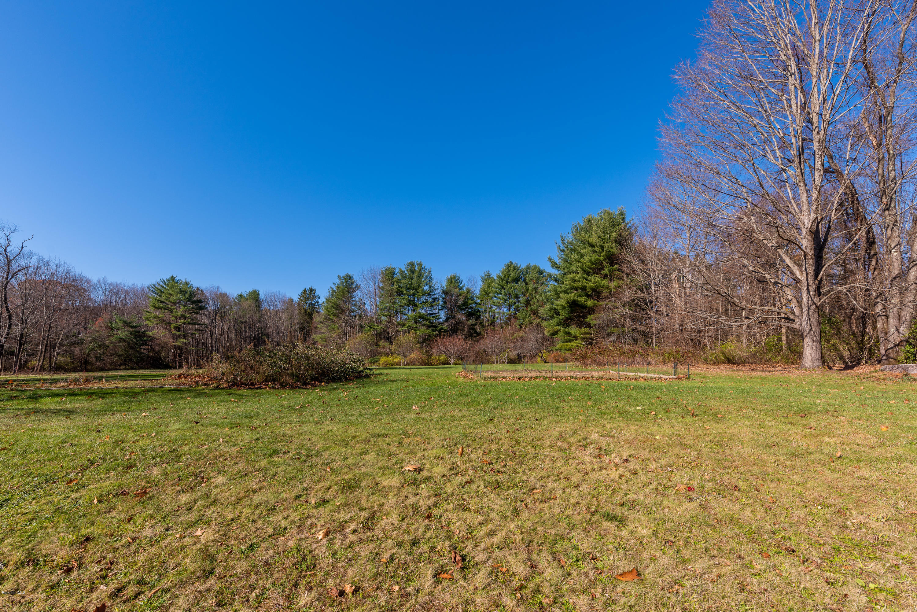 31 Interlaken Road Stockbridge, MA 01266 - Photo 21 of 34 a view of a field with an trees in the background