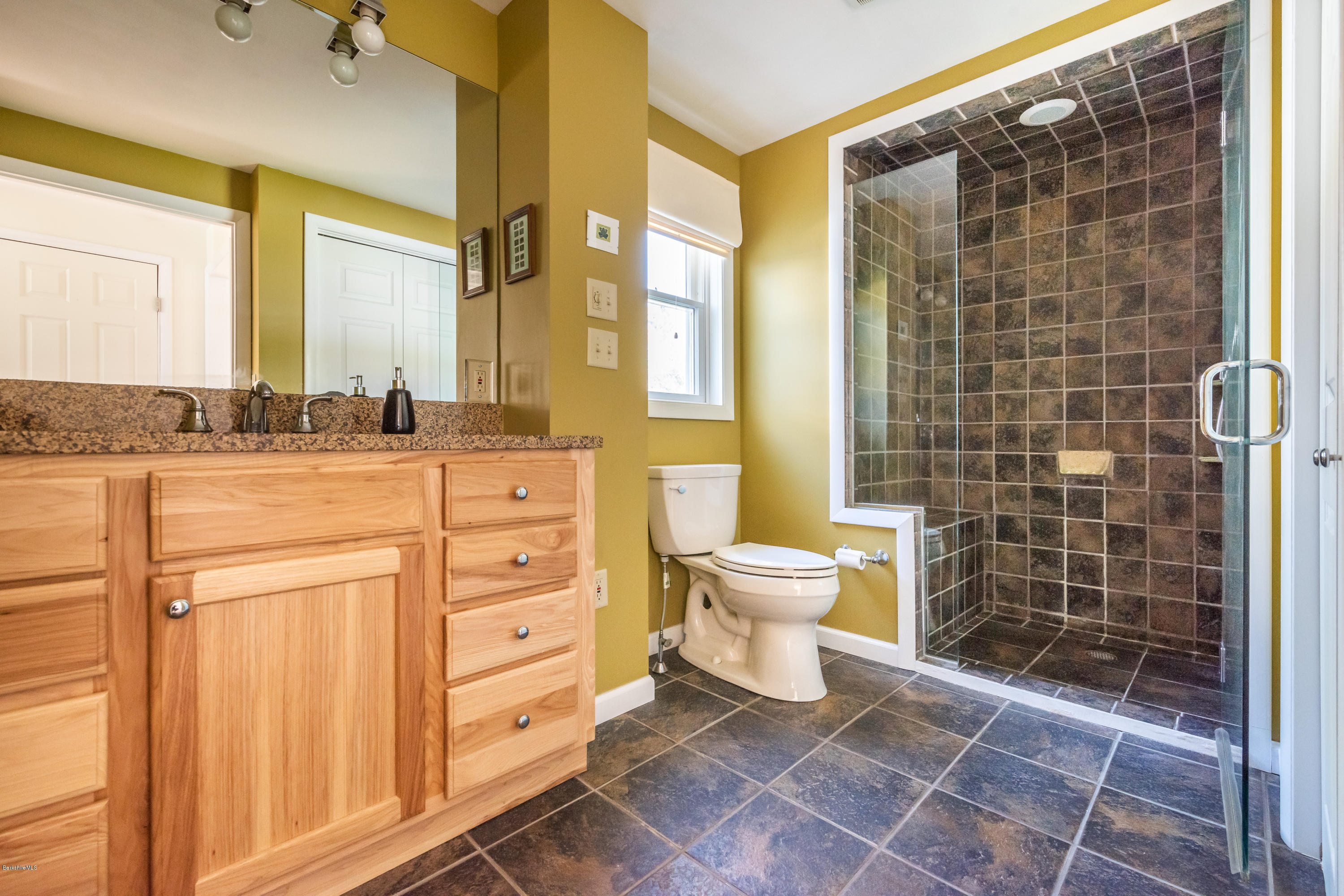 31 Interlaken Road Stockbridge, MA 01266 - Photo 22 of 34 a bathroom with a granite countertop sink a toilet and shower