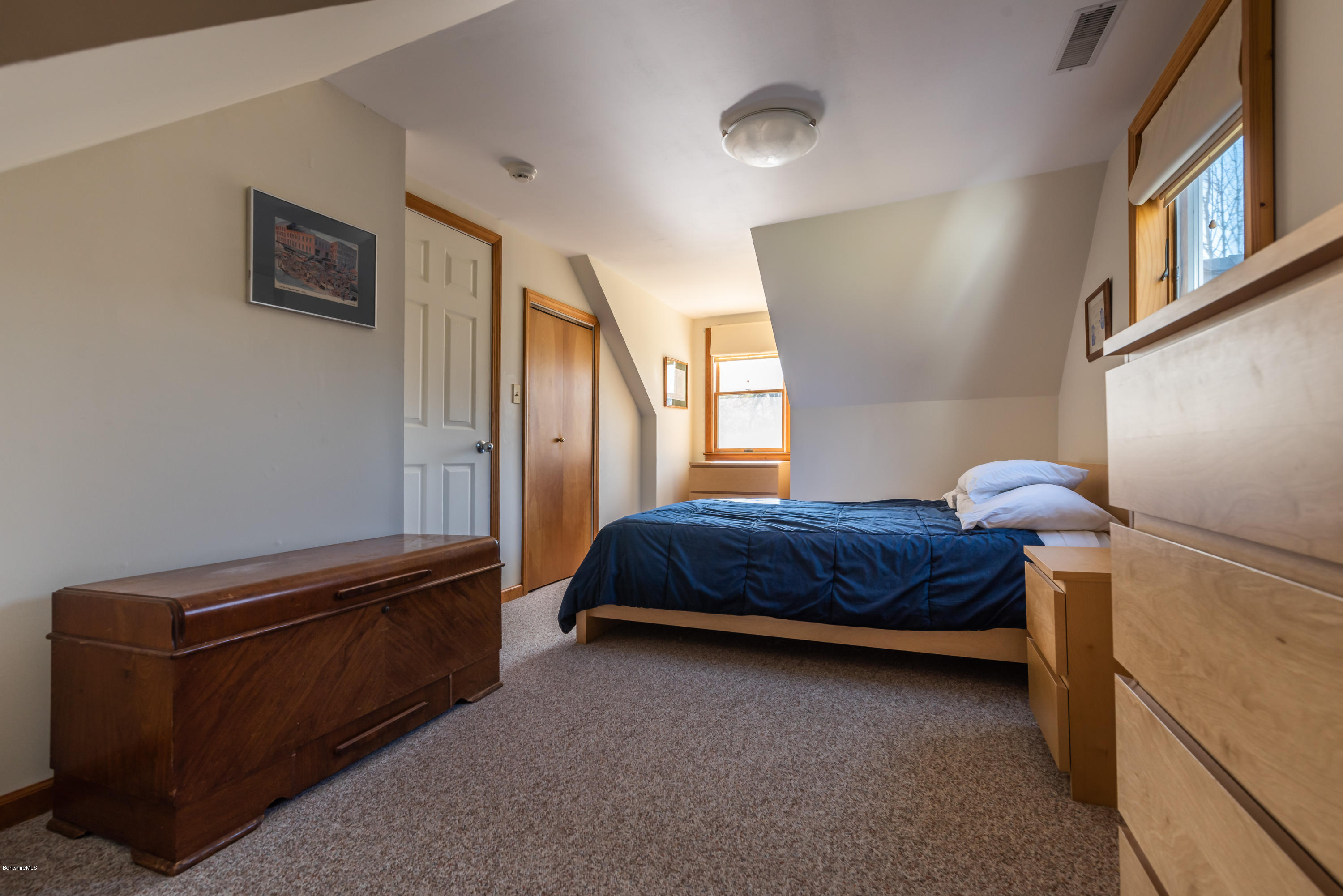 31 Interlaken Road Stockbridge, MA 01266 - Photo 24 of 34 a bedroom with a bed and window