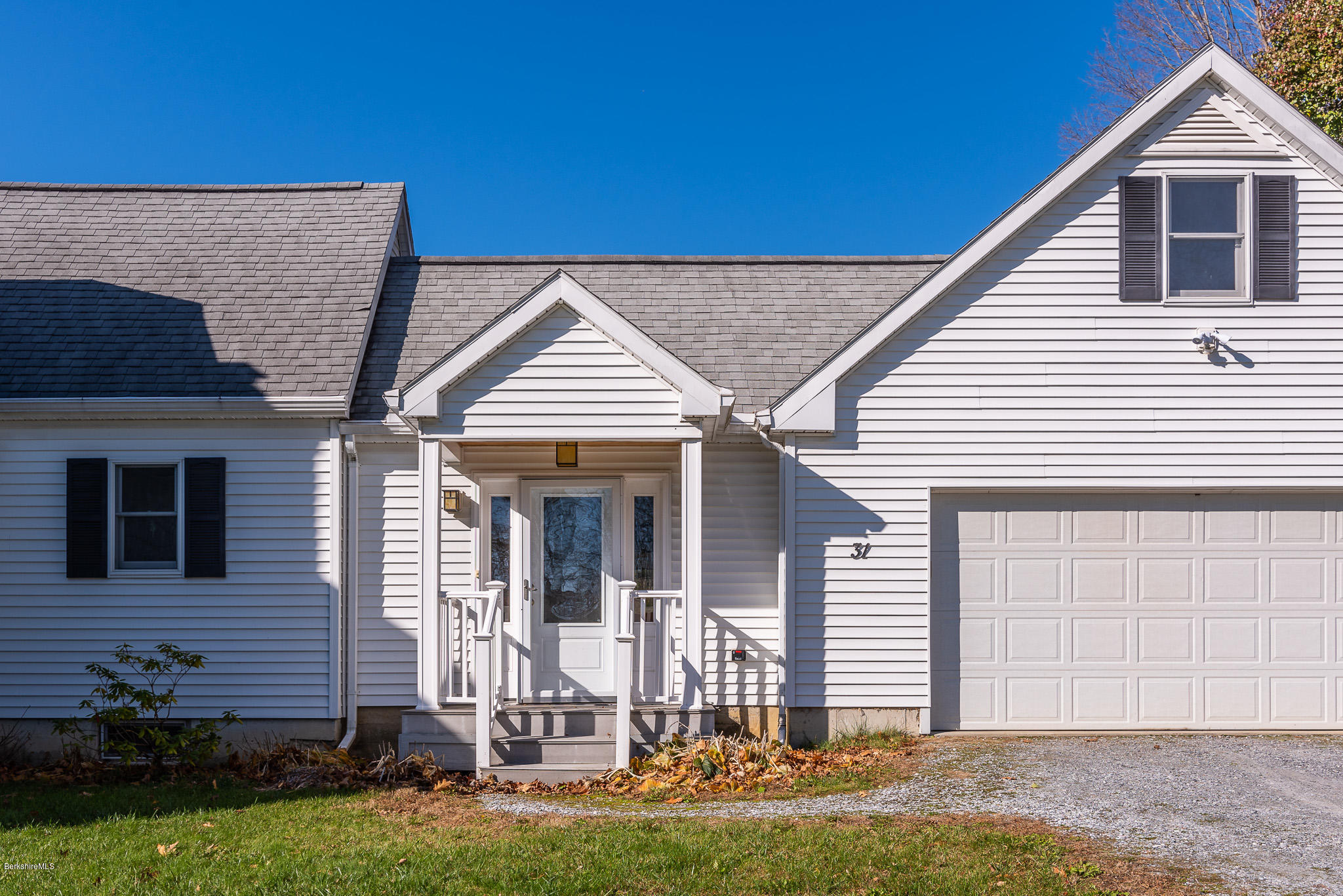 31 Interlaken Road Stockbridge, MA 01266 - Photo 4 of 34 a front view of a house with a yard