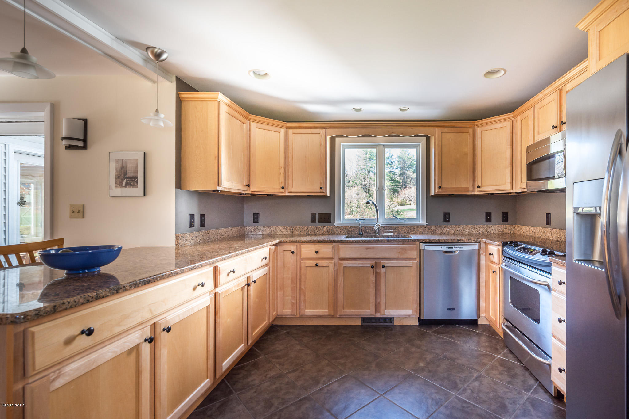 31 Interlaken Road Stockbridge, MA 01266 - Photo 7 of 34 a kitchen with stainless steel appliances granite countertop a stove sink and cabinets
