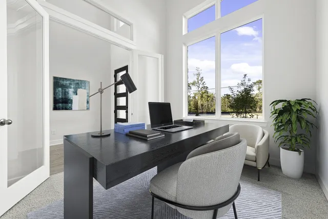 a workspace with furniture and window