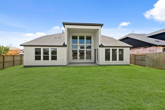 front view of a house with a garden