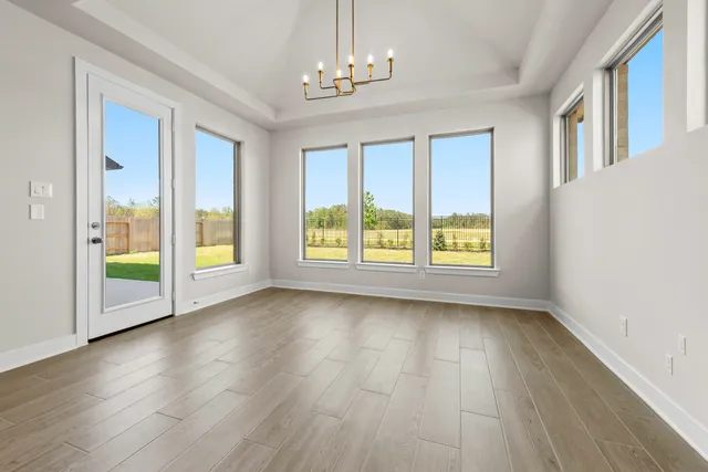 a view of room with window and hardwood floor