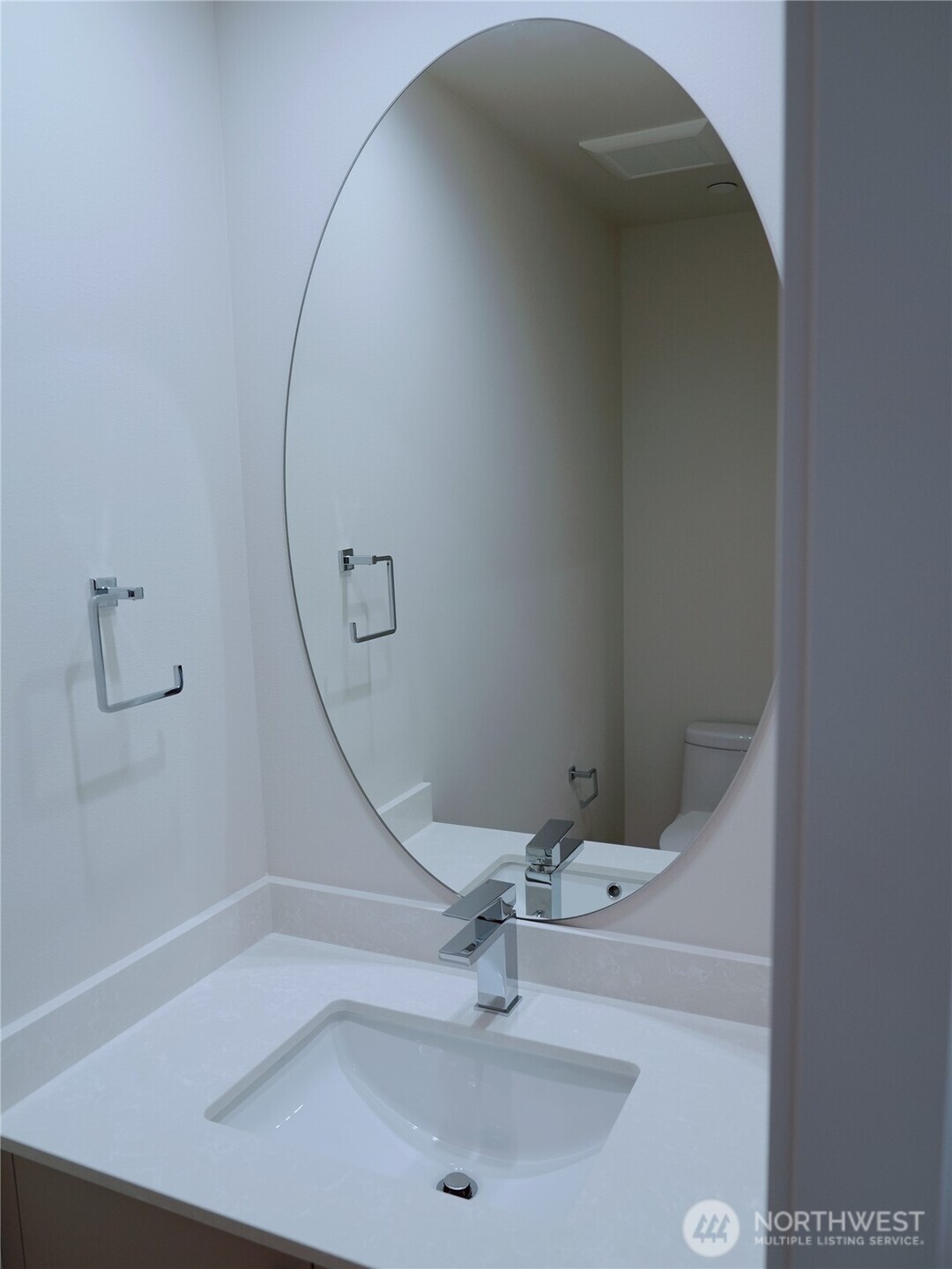 2155 Siddle Loop, Unit 106 Ferndale, WA 98248 - Photo 9 of 12 a bathroom with a sink and mirror