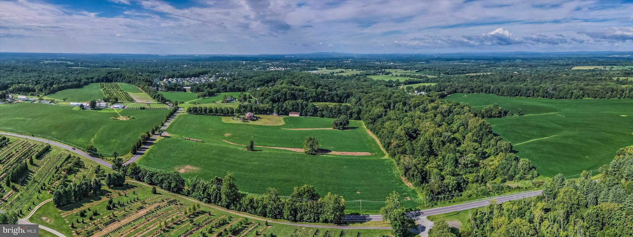 19101 Darnestown Road Poolesville, MD 20837 - Photo 25 of 27 a view of a grassy field with an trees