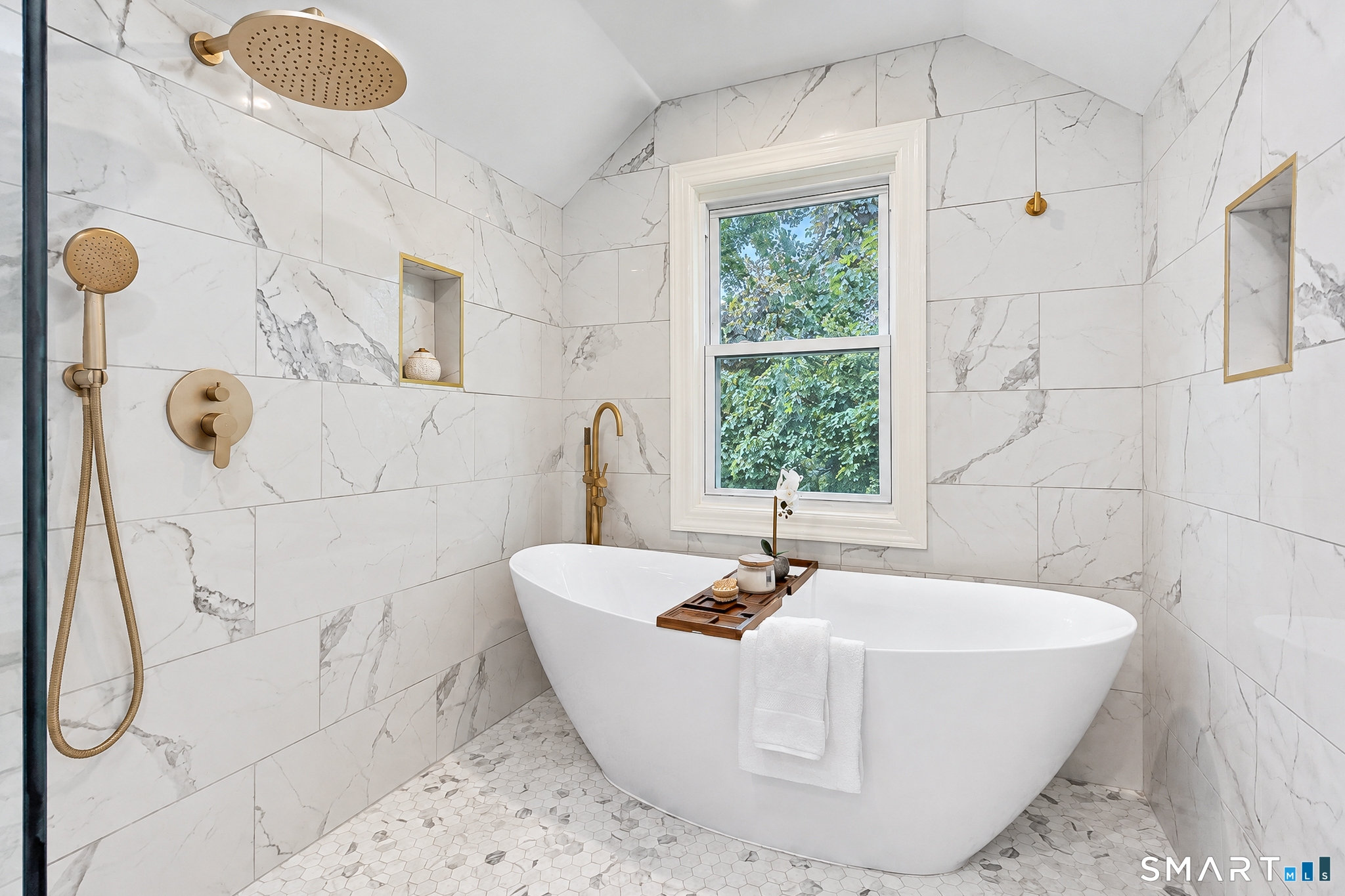 34 Rimmon Road Woodbridge, CT 06525 - Photo 27 of 40 Spa-inspired wet room featuring a freestanding soaking tub, rainfall shower and elegant brass fixtures.