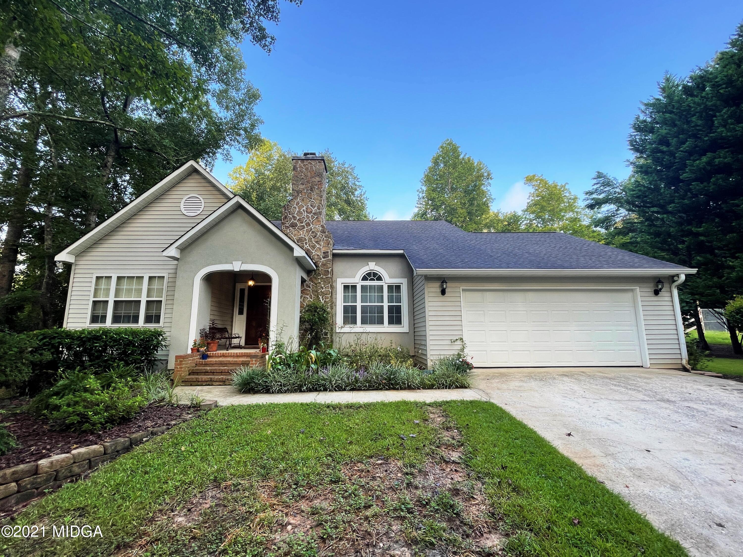 1480 Johnson Road Macon, GA 31220 - Photo 3 of 75 a front view of a house with garden