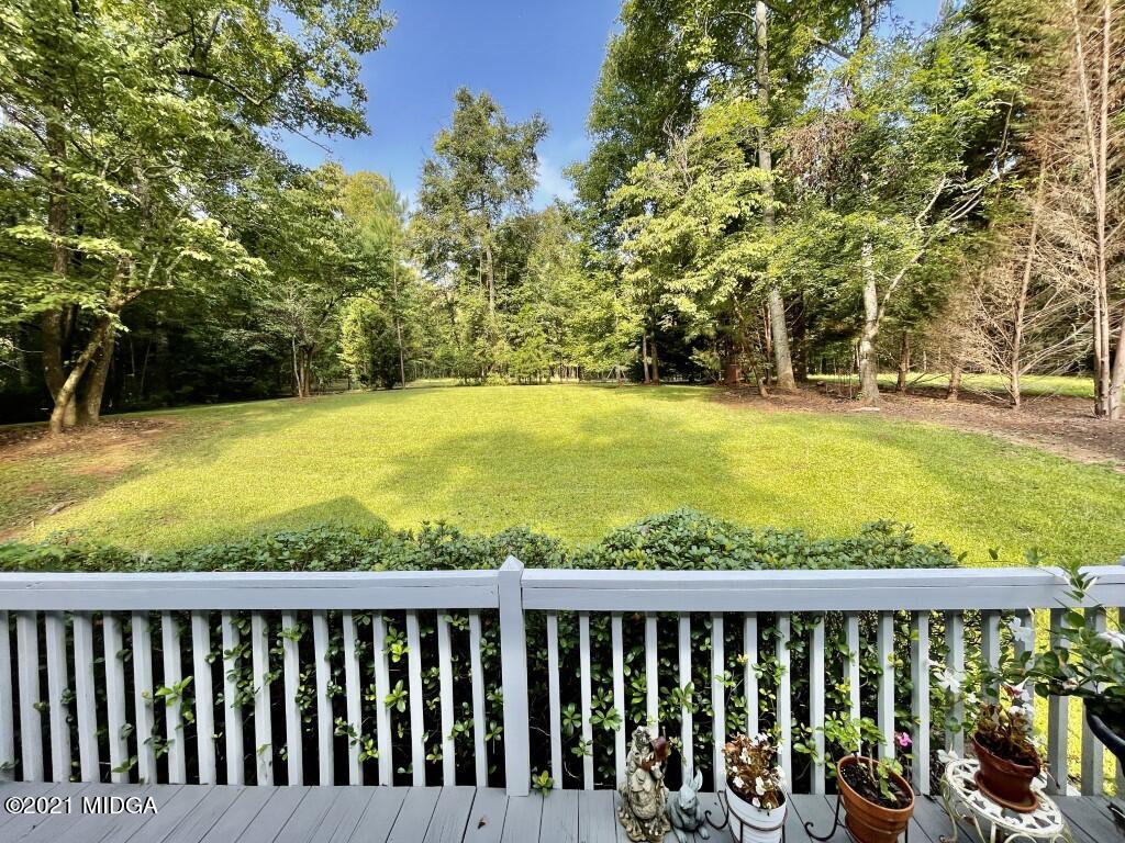 1480 Johnson Road Macon, GA 31220 - Photo 23 of 75 a view of swimming pool with deck and a garden