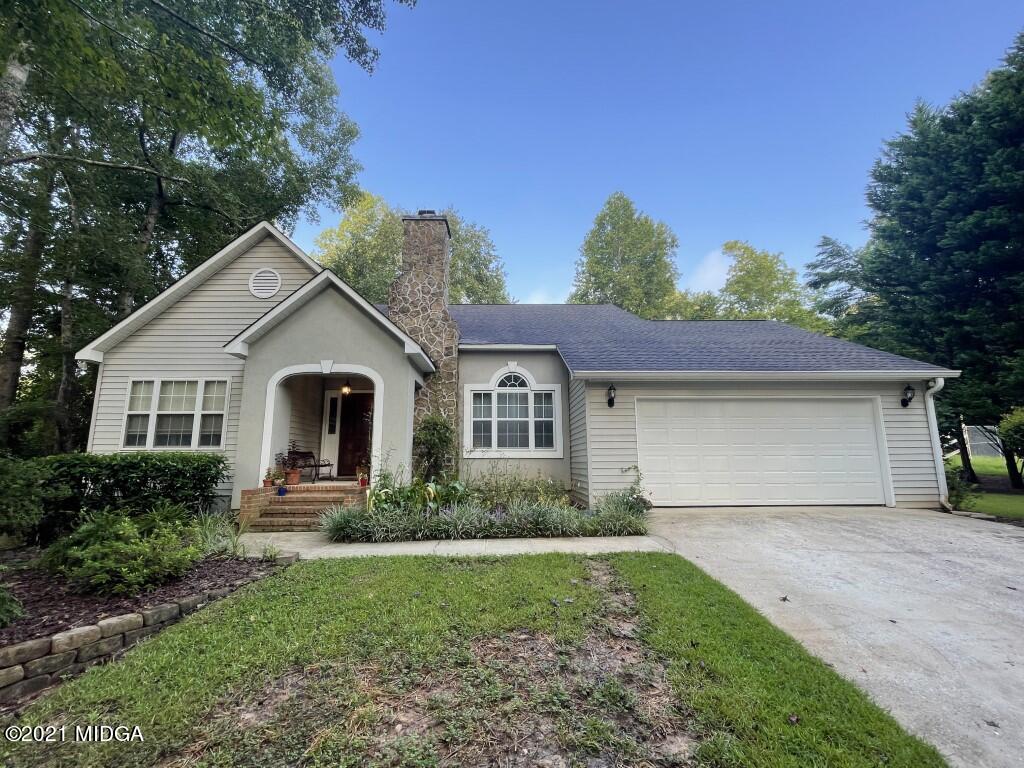 1480 Johnson Road Macon, GA 31220 - Photo 38 of 75 a front view of a house with a yard and garage