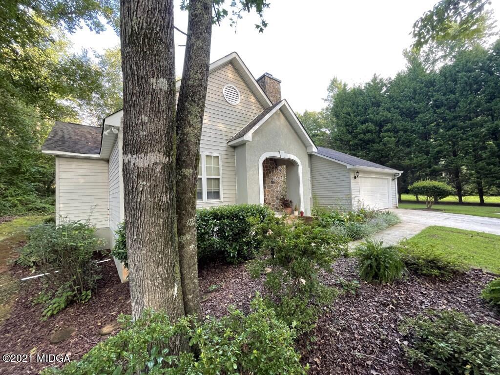 1480 Johnson Road Macon, GA 31220 - Photo 49 of 75 a view of a house with a yard and potted plants