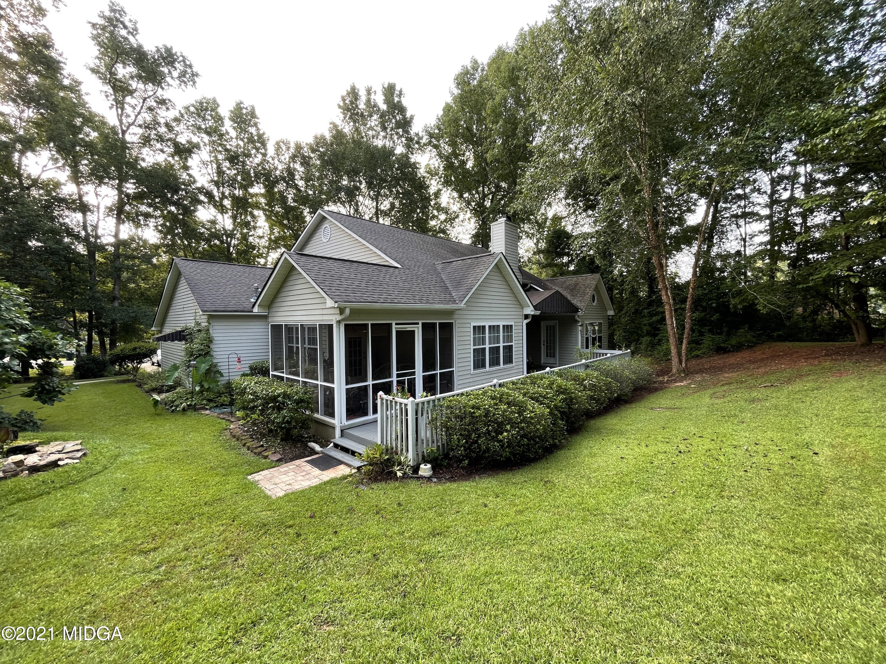 1480 Johnson Road Macon, GA 31220 - Photo 6 of 75 a front view of a house with garden