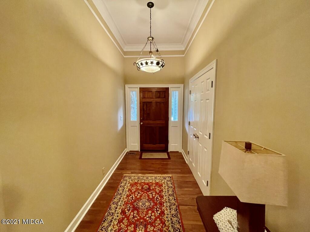 1480 Johnson Road Macon, GA 31220 - Photo 65 of 75 a view of a hallway with wooden floor and staircase