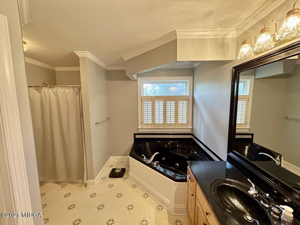 1480 Johnson Road Macon, GA 31220 - Photo 69 of 75 a bedroom with a bed and a window