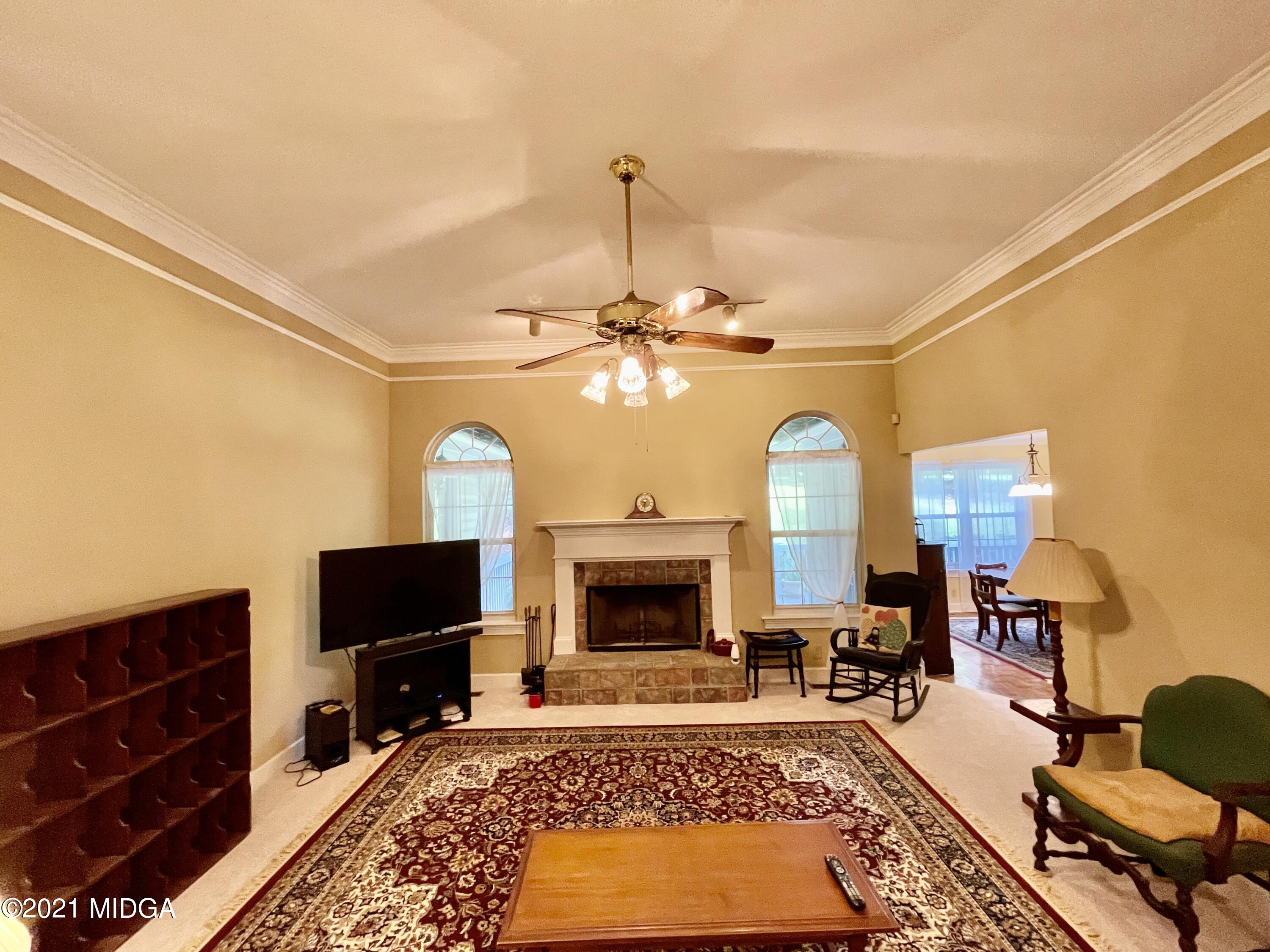 1480 Johnson Road Macon, GA 31220 - Photo 10 of 75 a living room with furniture fireplace and flat screen tv
