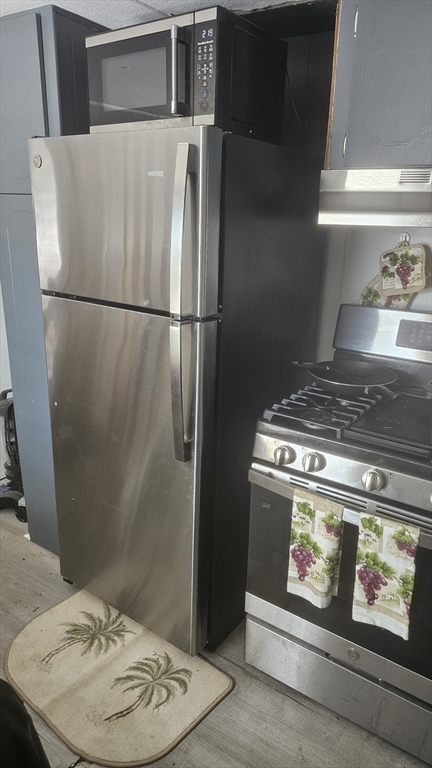 8 Gerald Drive Middleboro, MA 02346 - Photo 11 of 17 a stove top oven sitting inside of a kitchen