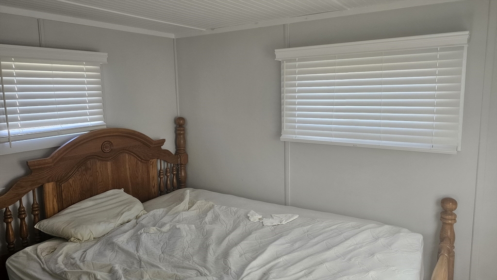 8 Gerald Drive Middleboro, MA 02346 - Photo 14 of 17 a bedroom with a bed and a window