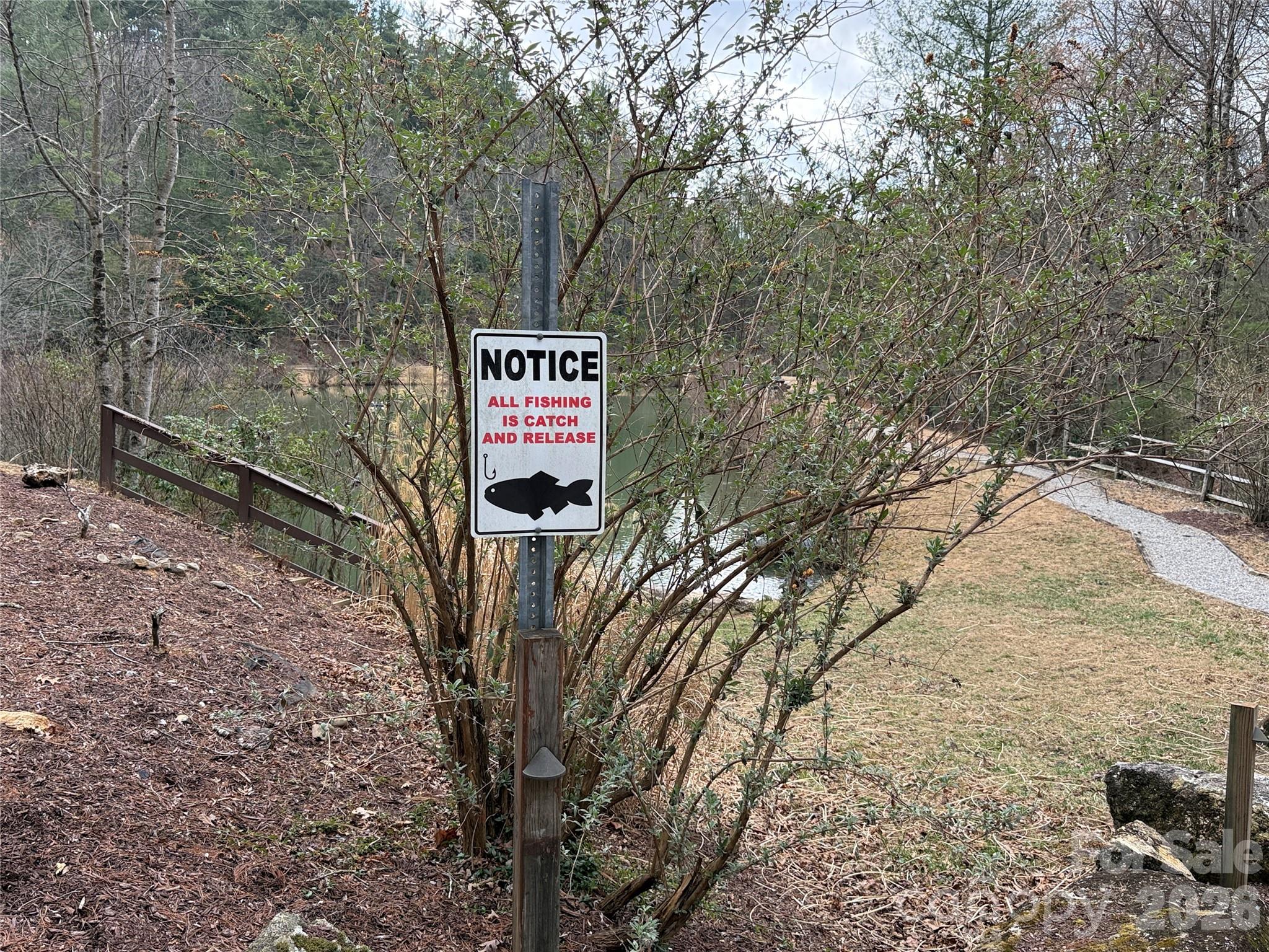 Tbd Staghorn Road, Unit 160 & 161 Purlear, NC 28665 - Photo 39 of 46 a sign that is on the side of a road