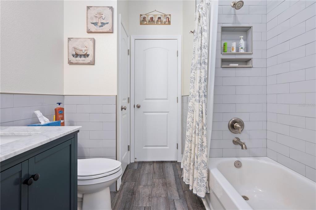 1212 Reynolds Road De Leon Springs, FL 32130 - Photo 26 of 32 a bathroom with a sink a toilet and shower