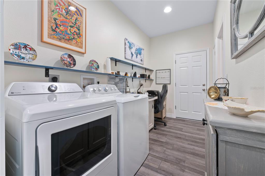 1212 Reynolds Road De Leon Springs, FL 32130 - Photo 27 of 32 a utility room with dryer and washer