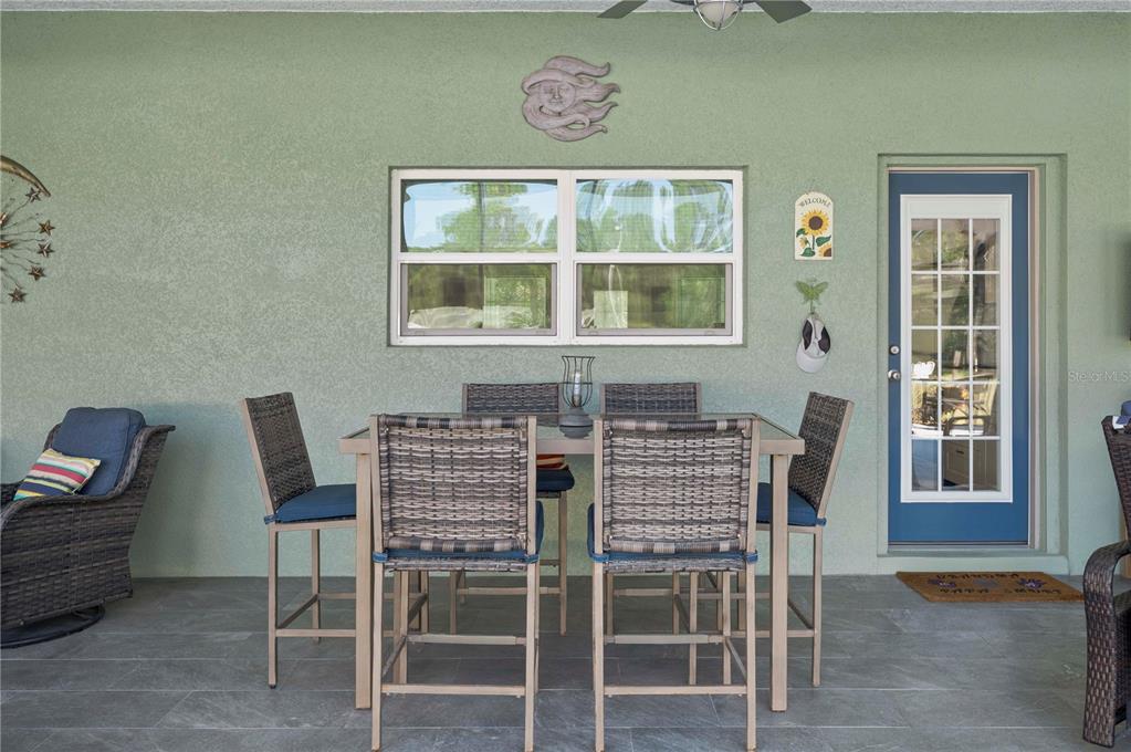 1212 Reynolds Road De Leon Springs, FL 32130 - Photo 30 of 32 a view of a dining room with furniture and window