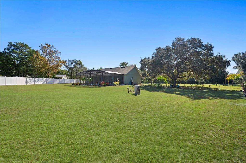 1212 Reynolds Road De Leon Springs, FL 32130 - Photo 31 of 32 a view of outdoor space with deck and yard