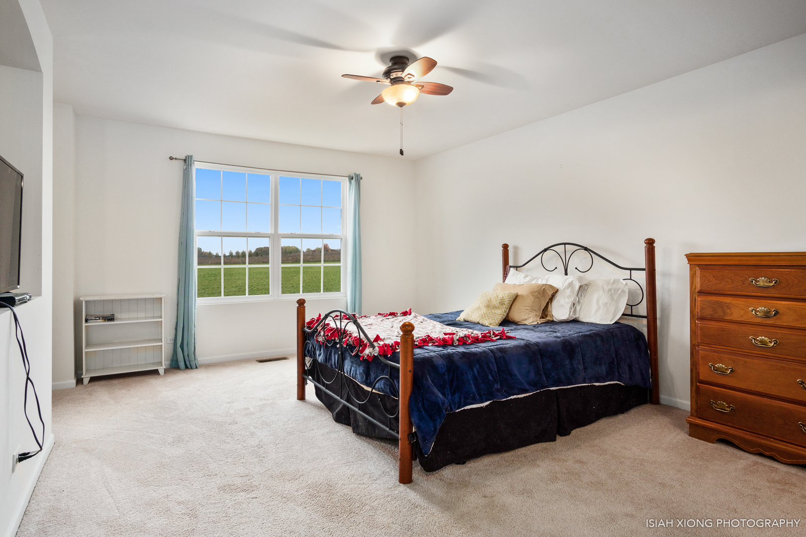 2964 Church Road Aurora, IL 60502 - Photo 8 of 16 a bedroom with a bed and a chandelier fan