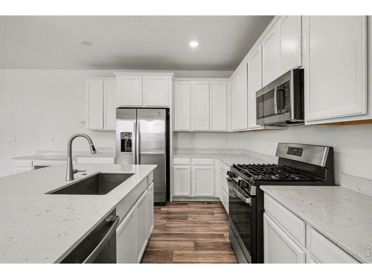 5258 Inland Avenue Firestone, CO 80504 - Photo 13 of 44 Stainless Appliances & Quartz Counters