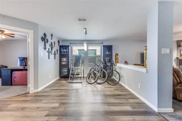 a view of a room with wooden floor