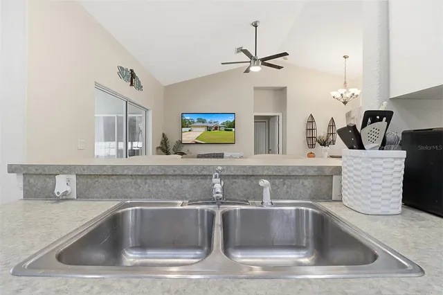 a view kitchen sink with granite countertop