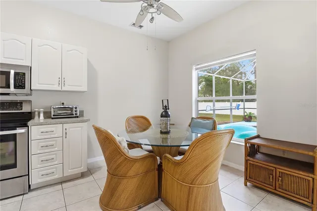 a dining room with furniture and window