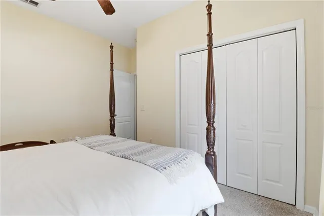 a bedroom with a bed and a shower