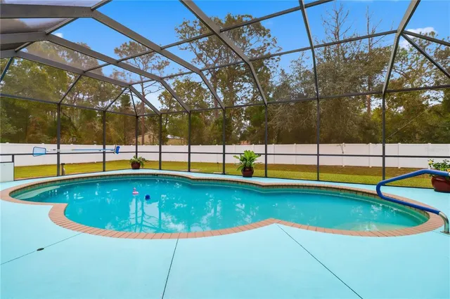 a view of a swimming pool with a bench