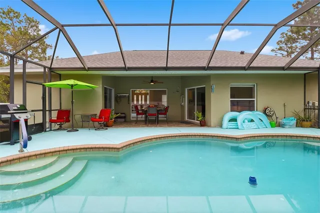 a view of a swimming pool with a patio