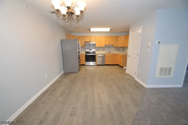 a view of a kitchen with a sink cabinets and a window